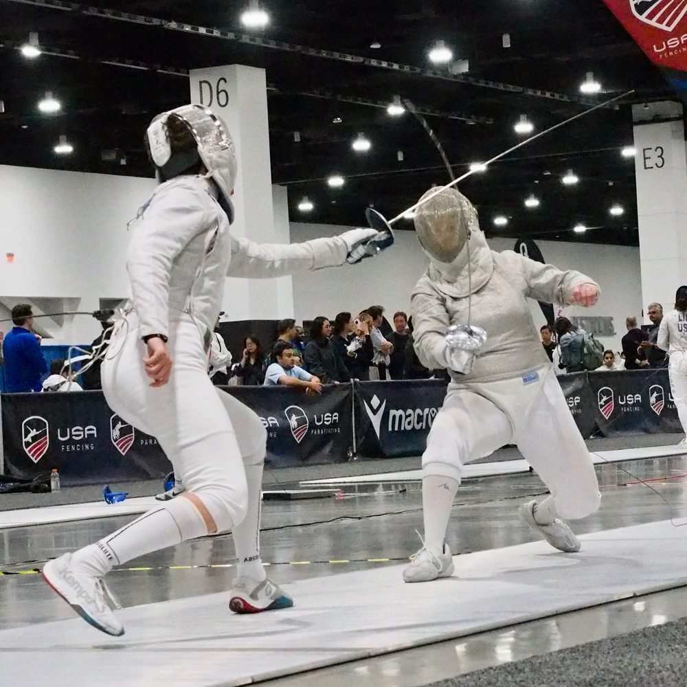 Nova saber fencers in a bout at a USA Fencing event