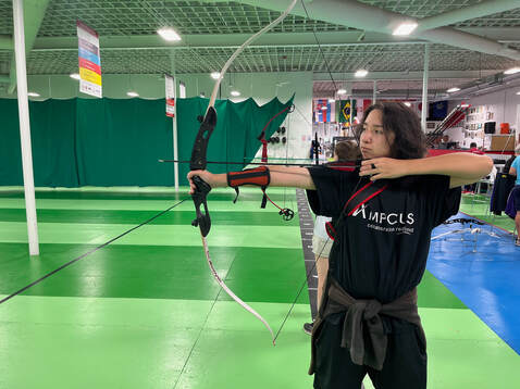 Girl Archer using a Compound Bow